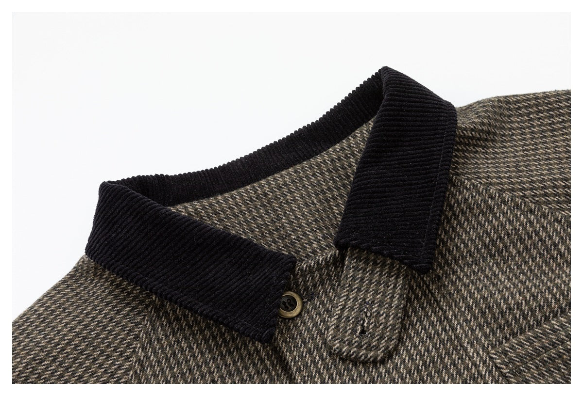 Close-up of the jacket's black ribbed collar and houndstooth fabric.