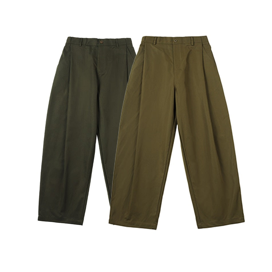 Two pairs of wide-leg pleated trousers shown from the front in dark olive and lighter brown-olive.
