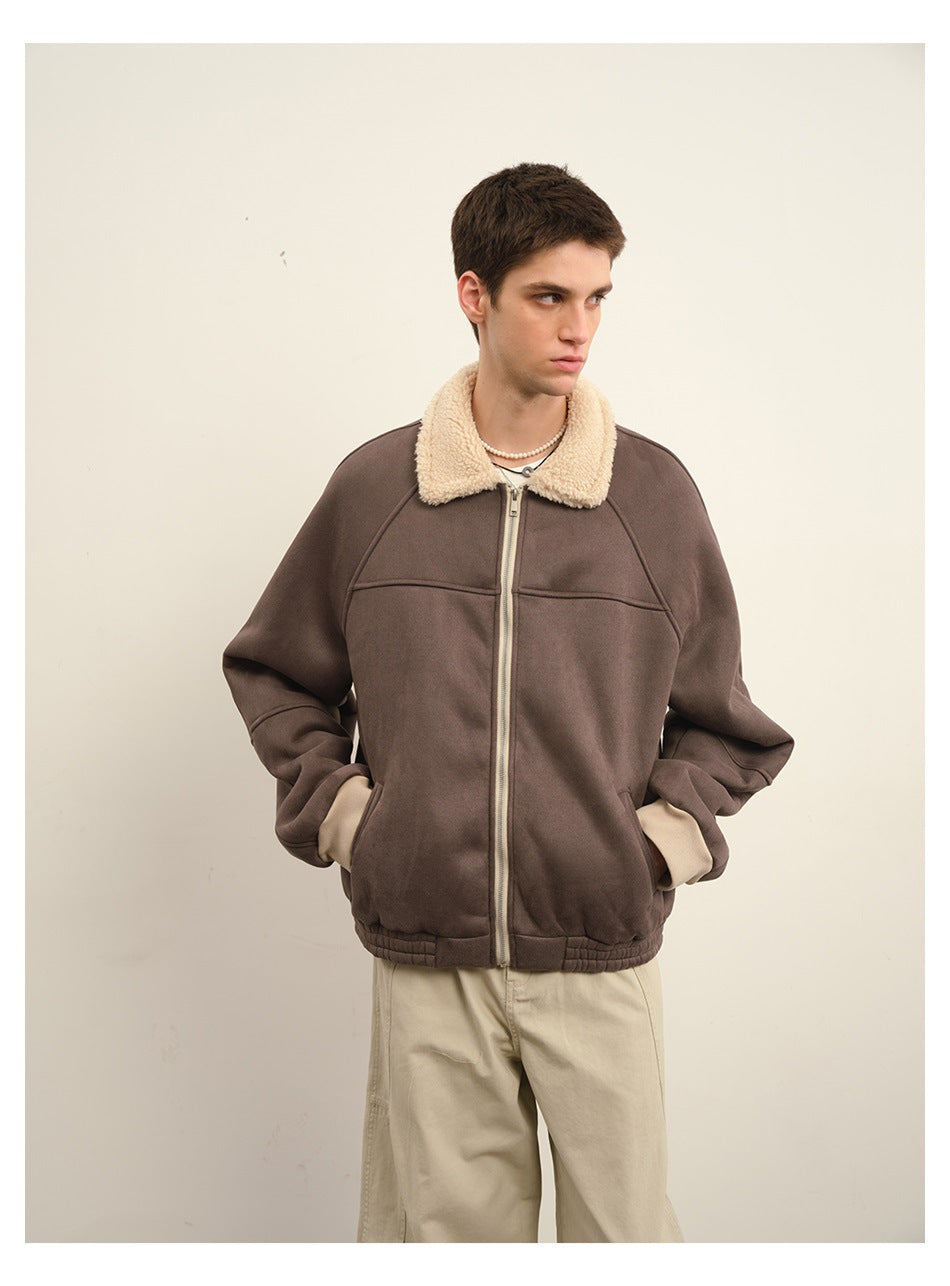 Model wearing a dark taupe zip-front jacket with a cream sherpa collar and cuffs, shown from the front.