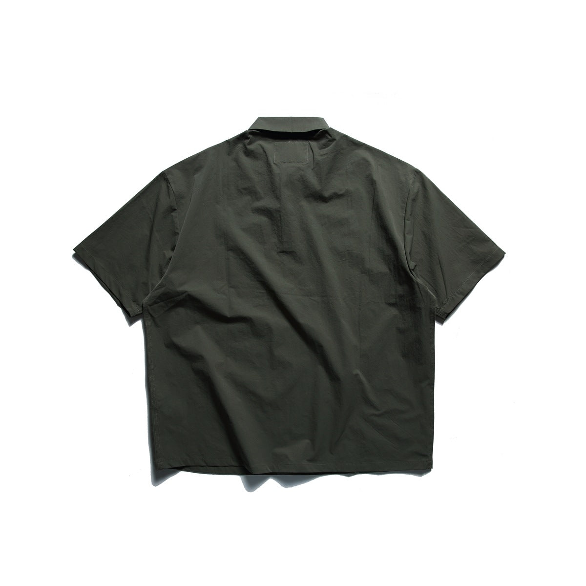 Back view of a dark olive short-sleeve collared shirt laid flat on a white background.