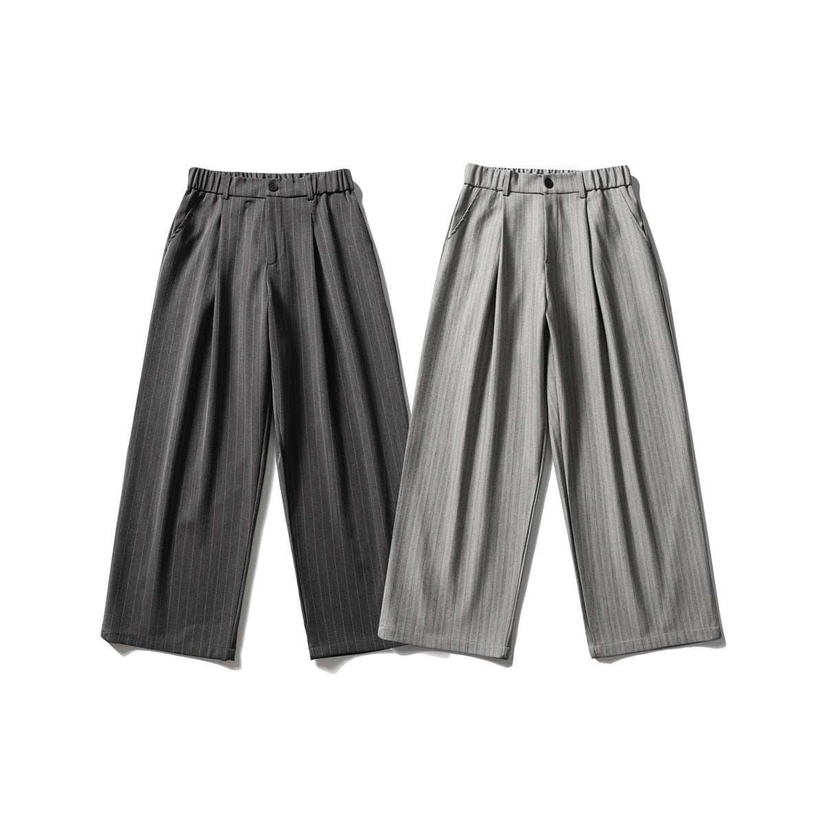 Two pairs of wide-leg pinstripe trousers shown from the front in dark charcoal and light gray.