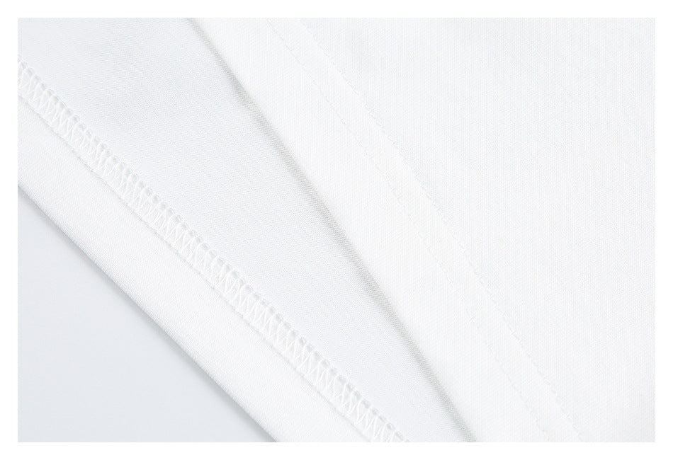 Close-up of a diagonal overlock seam on white garment fabric.