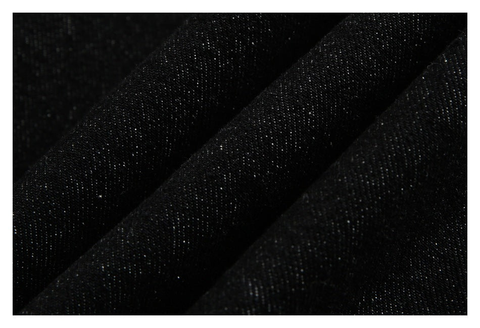 Macro view of the textured black denim fabric.