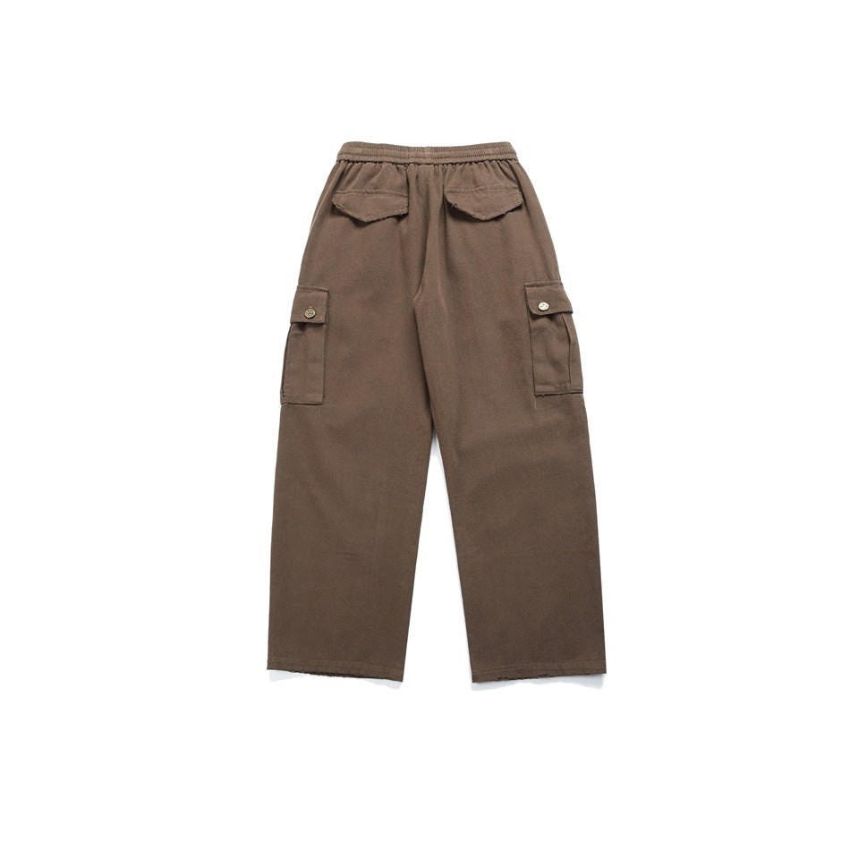 Flat-lay back view of brown wide-leg cargo pants with an elastic waist, two rear flap pockets and side cargo pockets.