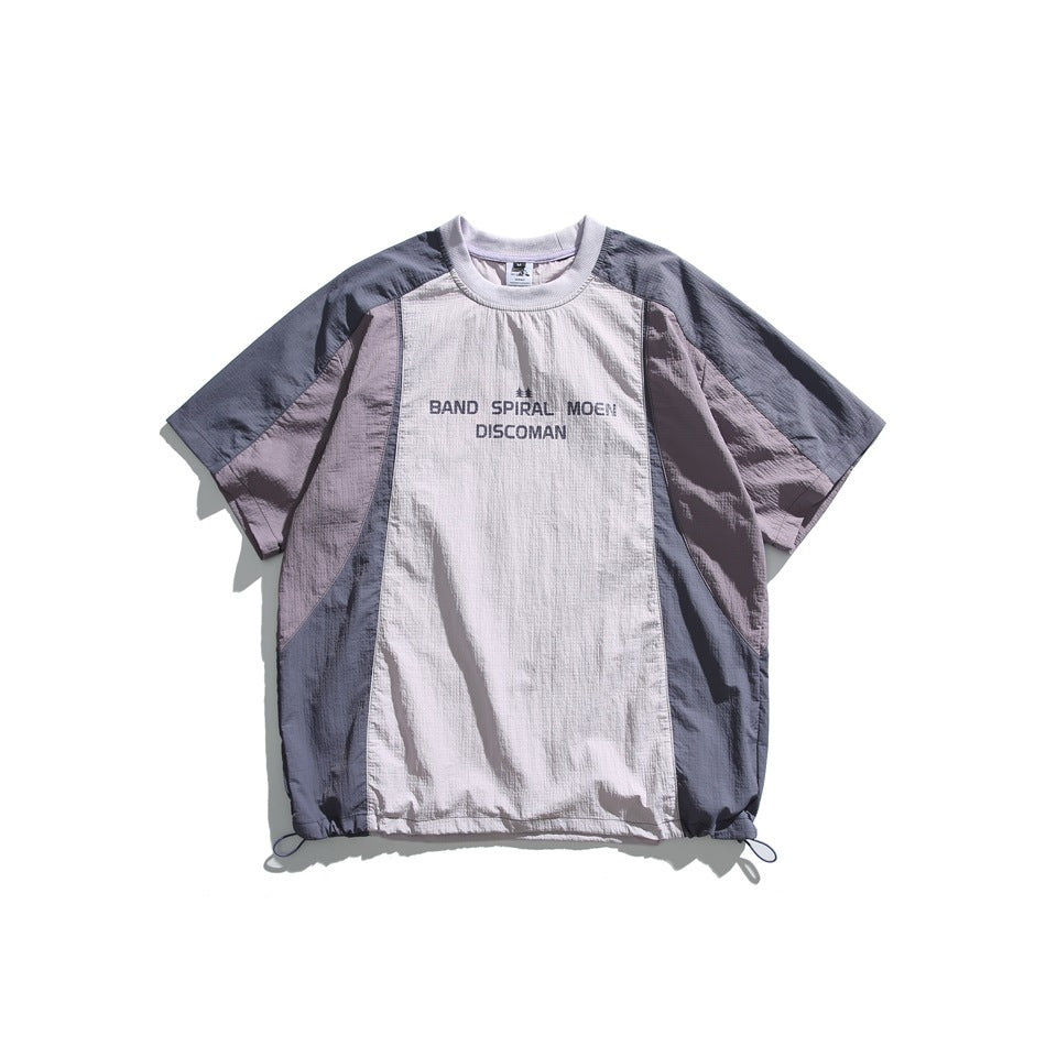 Purple and gray color-block short-sleeve tee with chest print and drawstring hem, flat lay front view