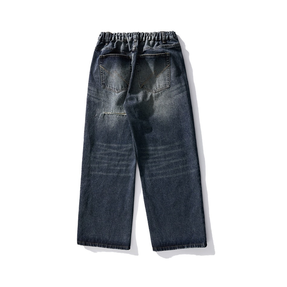 Back view of dark blue washed wide-leg jeans with elastic waistband and two patch back pockets