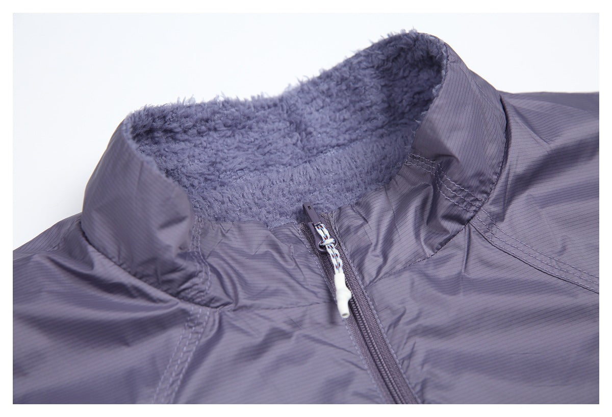 Close-up of the fuzzy-lined stand collar and front zipper on the lavender-gray vest.