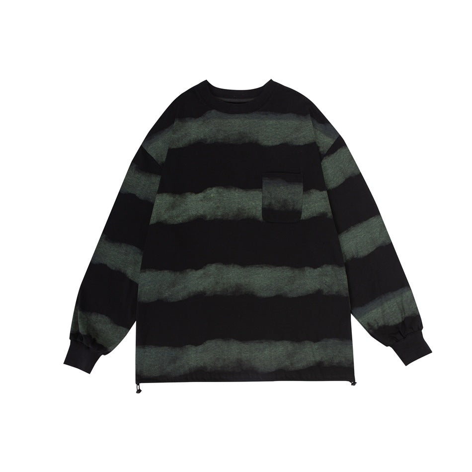 Black long-sleeve crew-neck top with faded green horizontal stripes, chest pocket and drawcord hem, flat front view