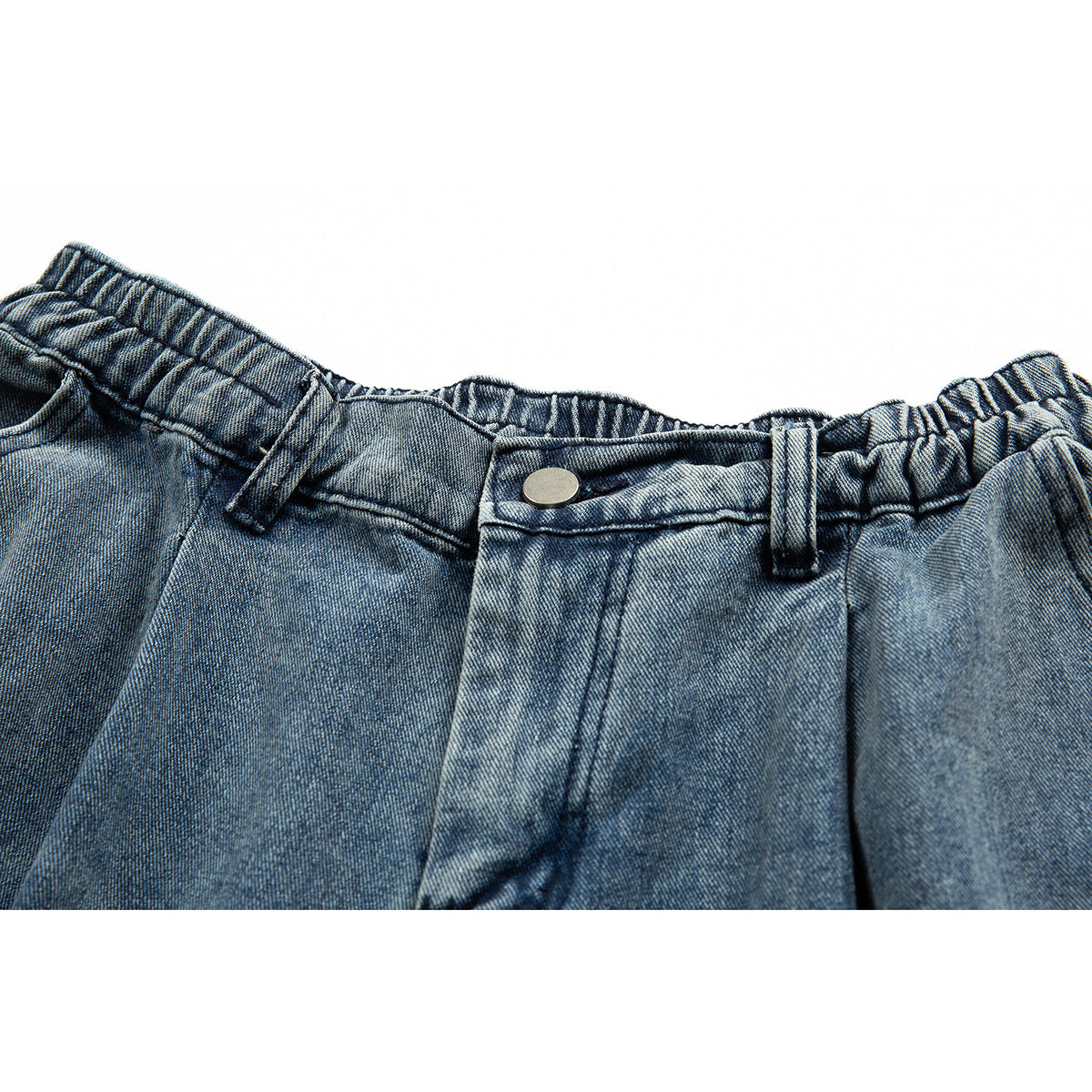 Close-up of blue denim shorts showing the elasticated waistband, belt loops and metal button.