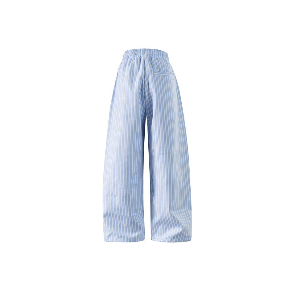 Back view of light blue striped wide-leg pants with elastic waistband and welt pocket