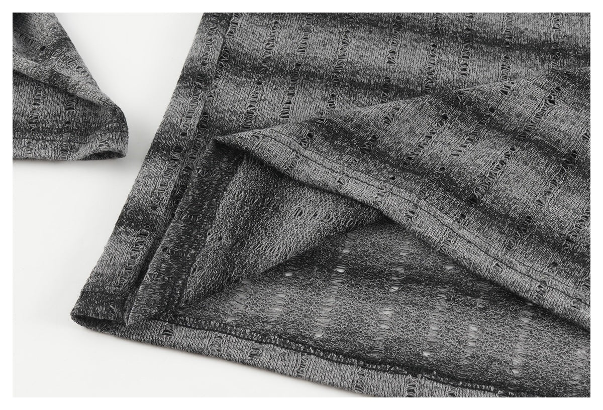 Close-up showing the inside stitching and finished edge of the gray-and-black patterned top.