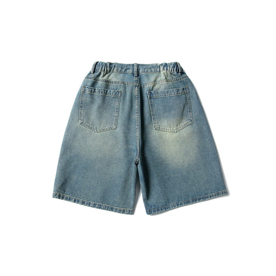Back of faded blue denim shorts showing two patch pockets and an elastic waistband