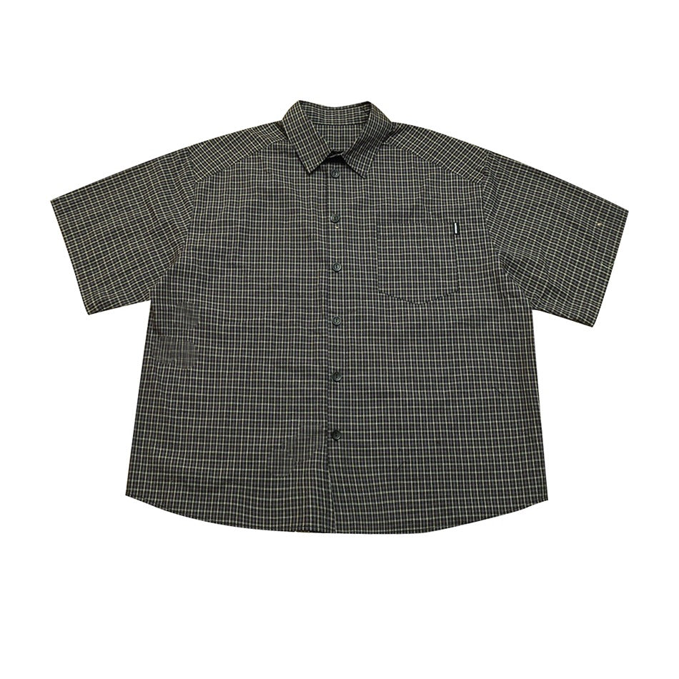 Black and off-white plaid short-sleeve button-up shirt, front flat lay with chest pocket and collar