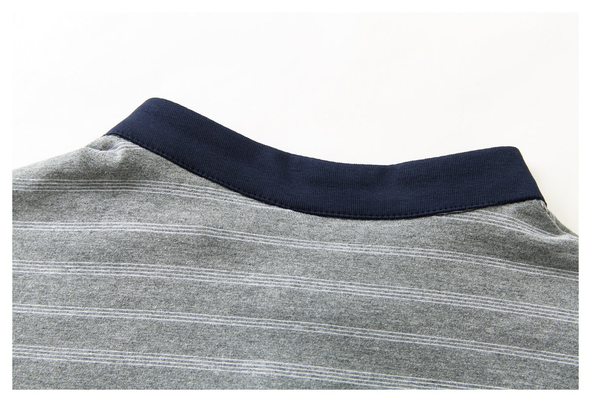 Close-up of a dark navy ribbed neckline on a gray garment with fine horizontal stripes.