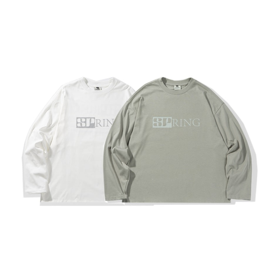 Two long-sleeve crewneck shirts laid flat side by side in white and light gray, each with a pale chest graphic.
