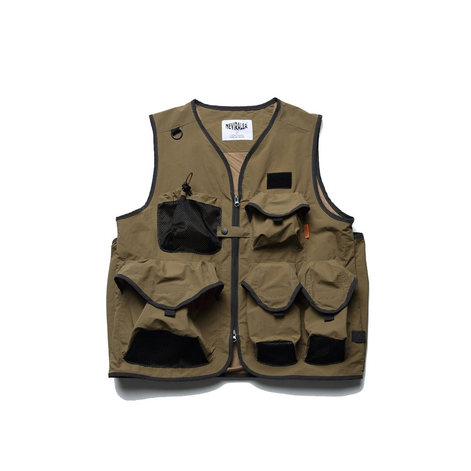 Khaki olive utility vest with zip front, multiple flap pockets, black mesh pocket and dark gray binding, flat view
