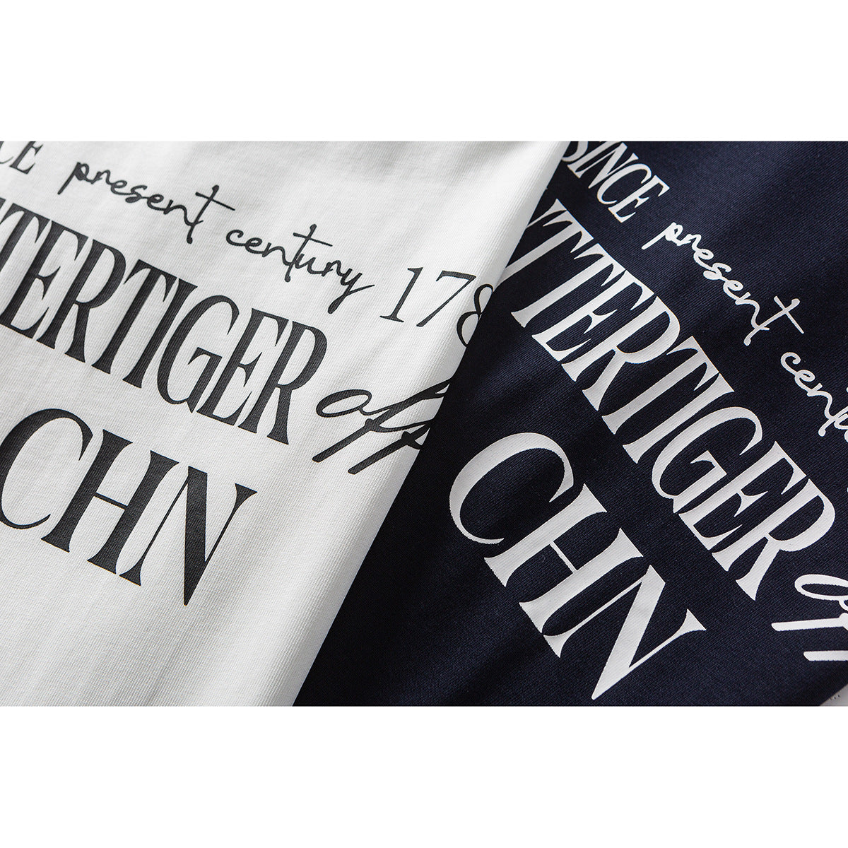 Close-up of white and navy shirt fabric with large contrasting English text prints.