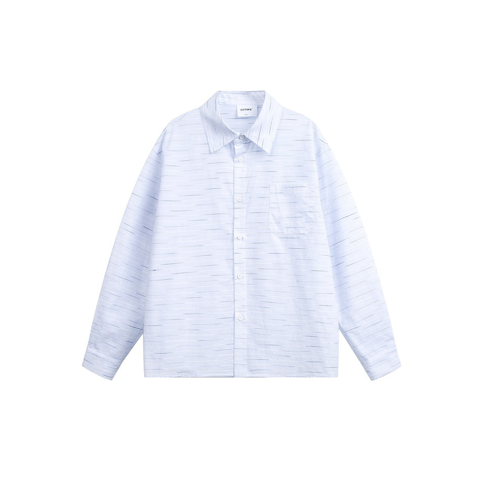 Light blue and white broken-stripe long-sleeve button-up shirt with chest pocket, laid flat on white background