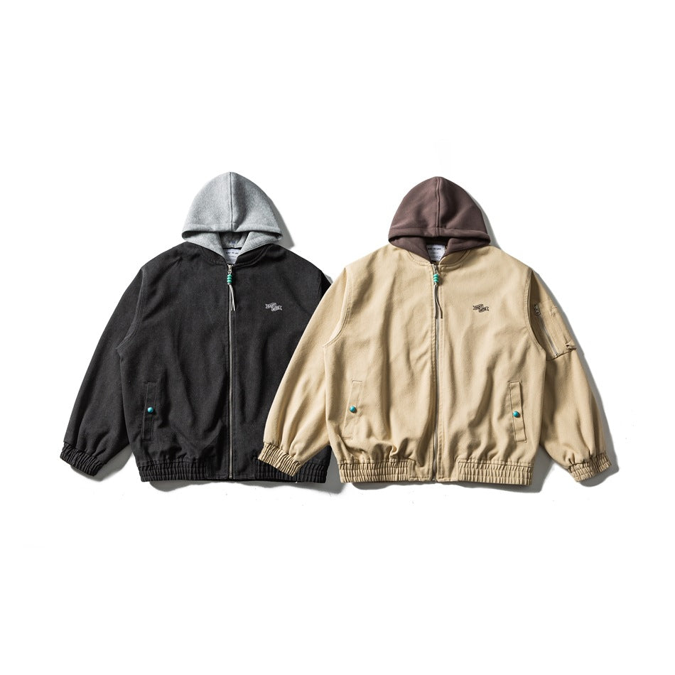 Two hooded zip-front jackets shown from the front: one black with a gray hood, the other beige with a brown hood.