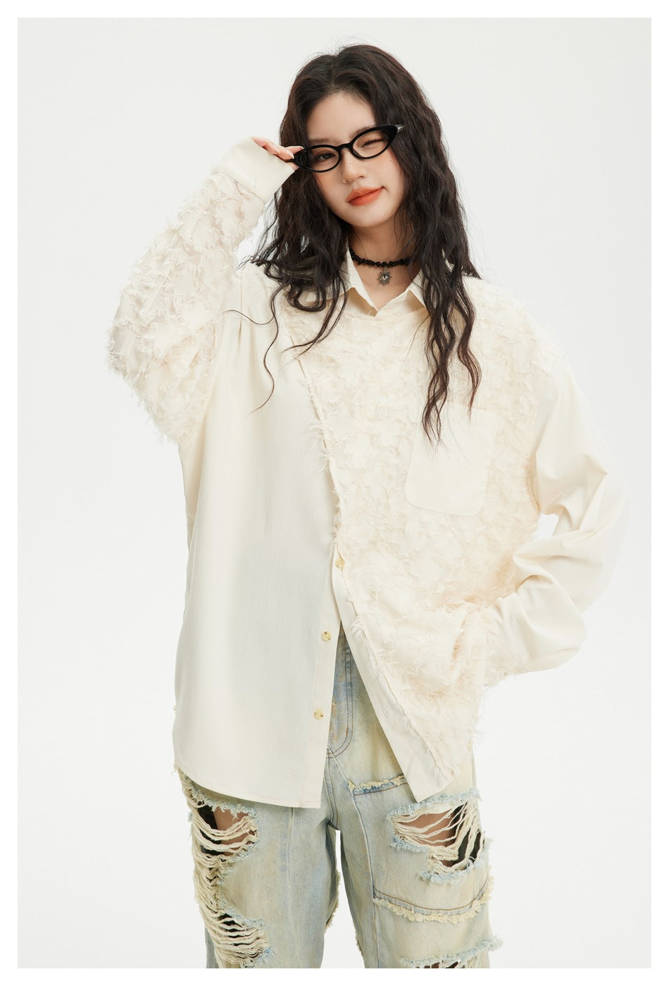 Closer view of an ivory button-front shirt with a chest pocket and shaggy textured panels across the front and sleeve.