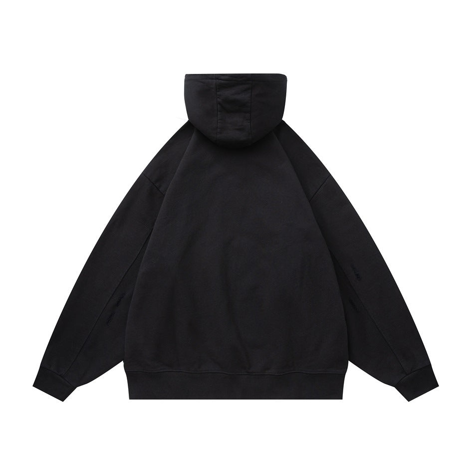 Back view of black hoodie flat lay showing the hood, dropped shoulders, ribbed cuffs and hem