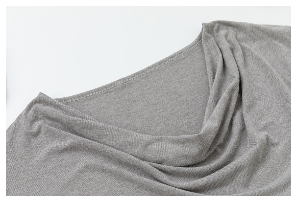 Close-up of the gray top's wide draped neckline and stitching.