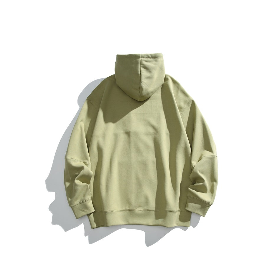 Back view of a pale olive-green pullover hoodie laid flat against a white background.