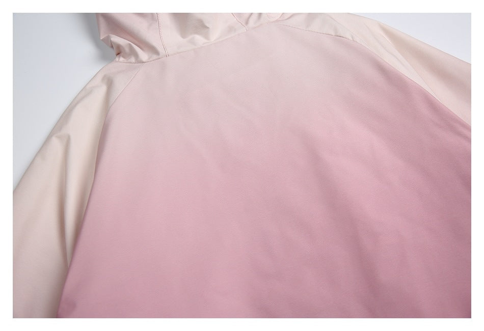 Close-up of a pale pink jacket body with light cream contrasting sleeves.