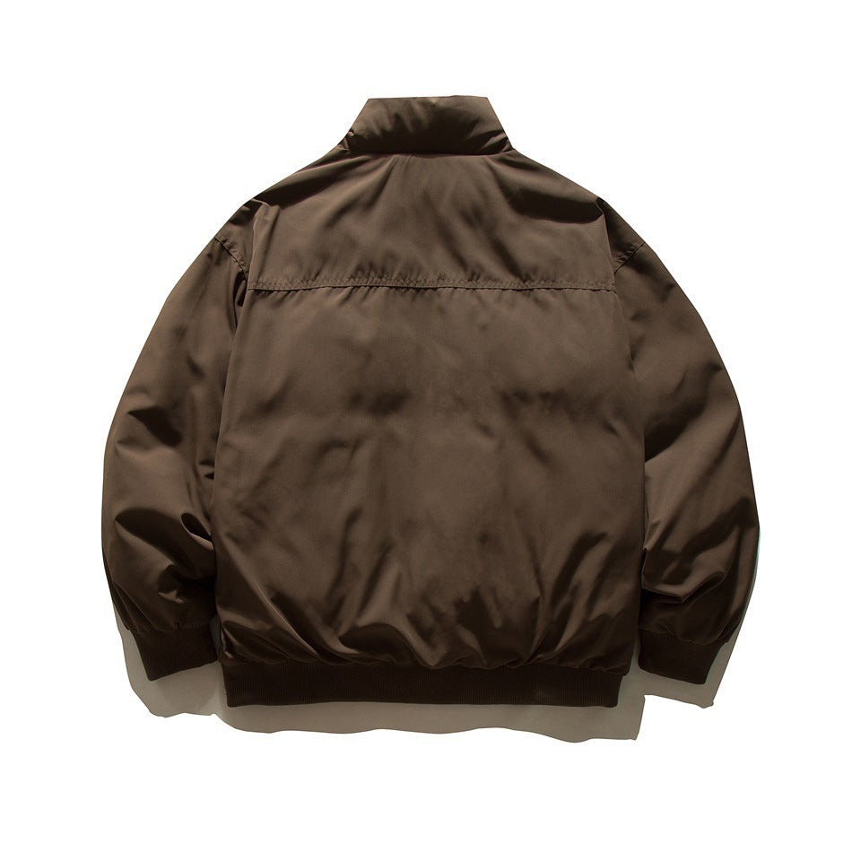 Back view of a brown jacket with a stand collar, gathered sleeves, and ribbed cuffs and hem.