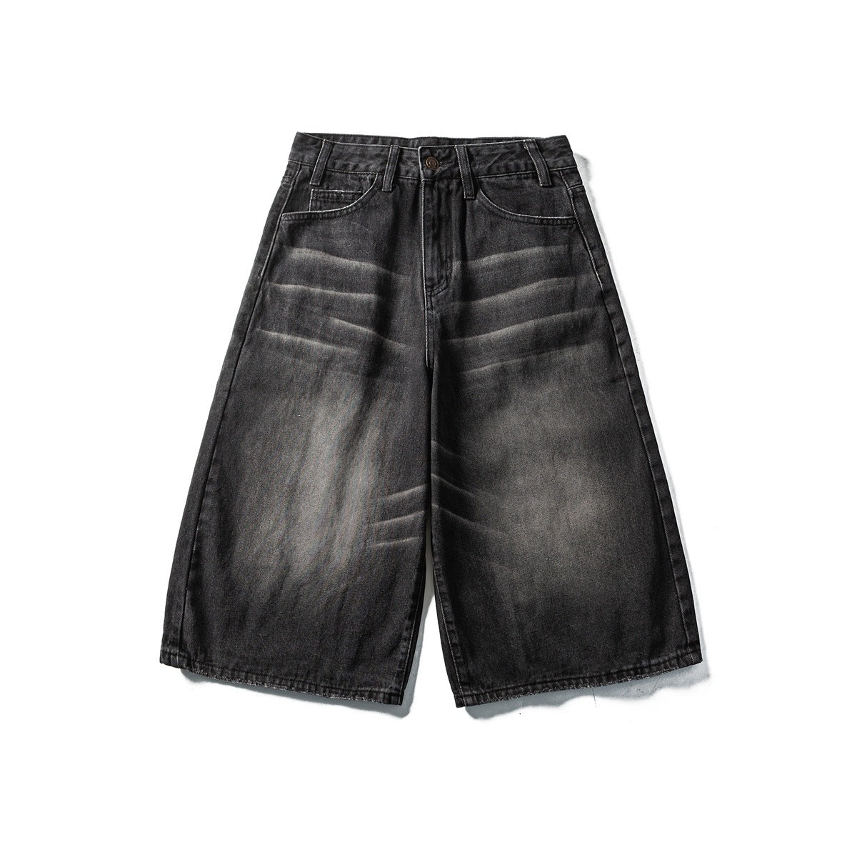 Black washed denim wide-leg shorts laid flat, front view with button fly, belt loops and faded whisker creases