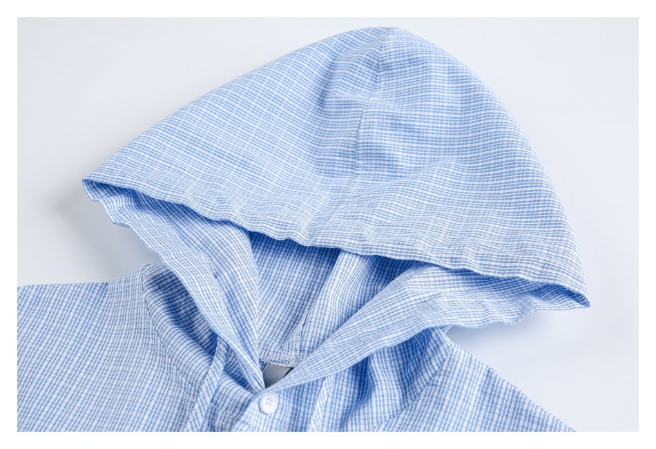 Close-up of the hood and collar of a light blue fine-check shirt.