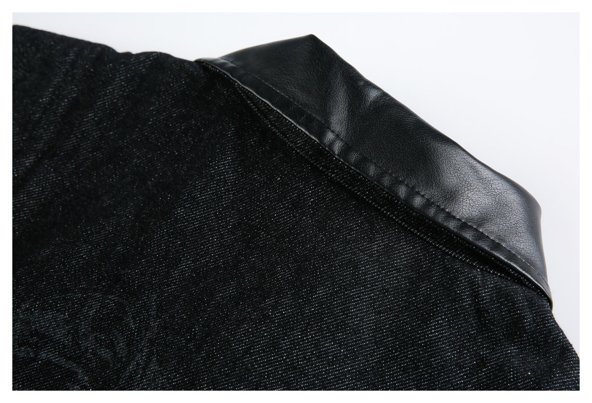Close-up of black textured fabric with a stitched, smooth black panel along the edge.