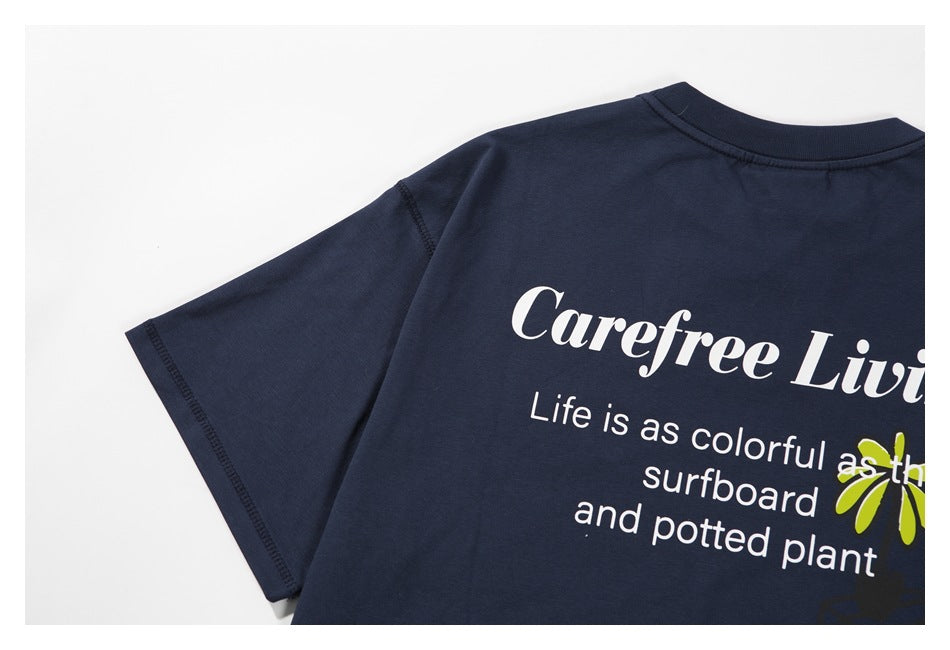 Close view of a navy T-shirt’s back print and short sleeve.