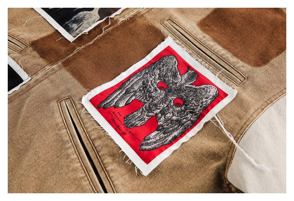 Close-up of a tan jacket with a red patch showing a black-and-white owl illustration.