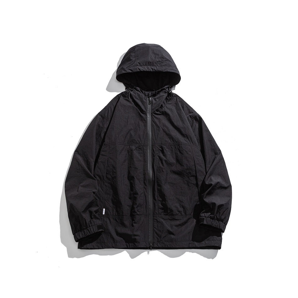 Black hooded zip-up jacket with chest panel seams and elastic cuffs, flat front view