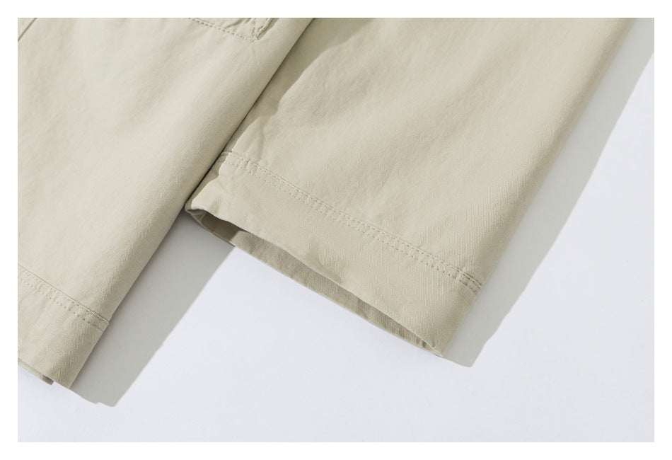 Close-up of a pale beige garment sleeve and stitched cuff.