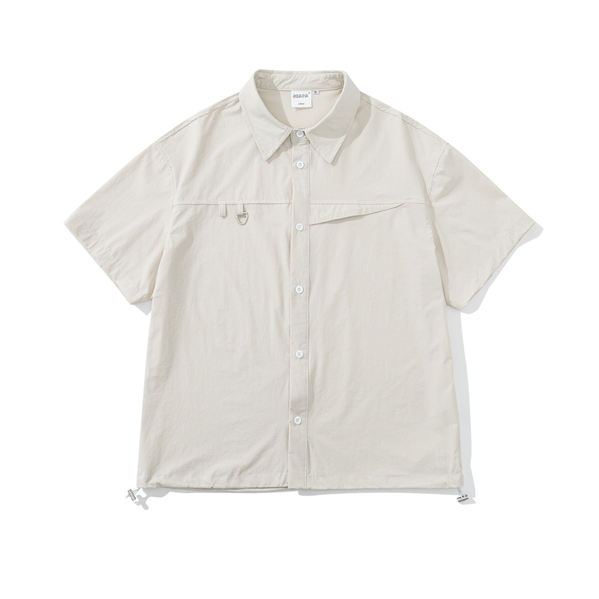 Off-white short-sleeve button-up shirt with pointed collar, diagonal chest pocket, metal ring detail and drawcord hem