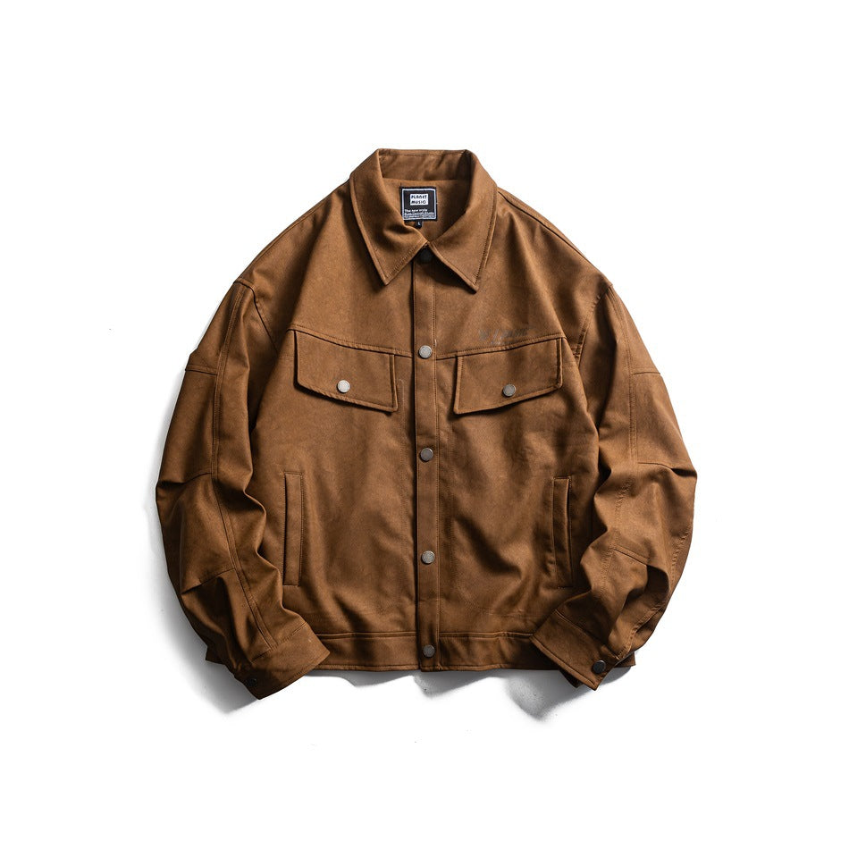 Brown button-front jacket with pointed collar, chest flap pockets and snap cuffs, laid flat