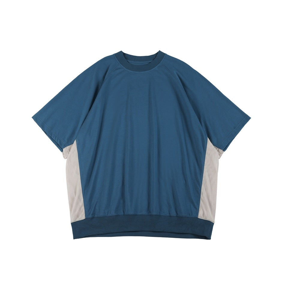 Blue short-sleeve raglan tee with ribbed collar and hem and light gray mesh side panels, front view