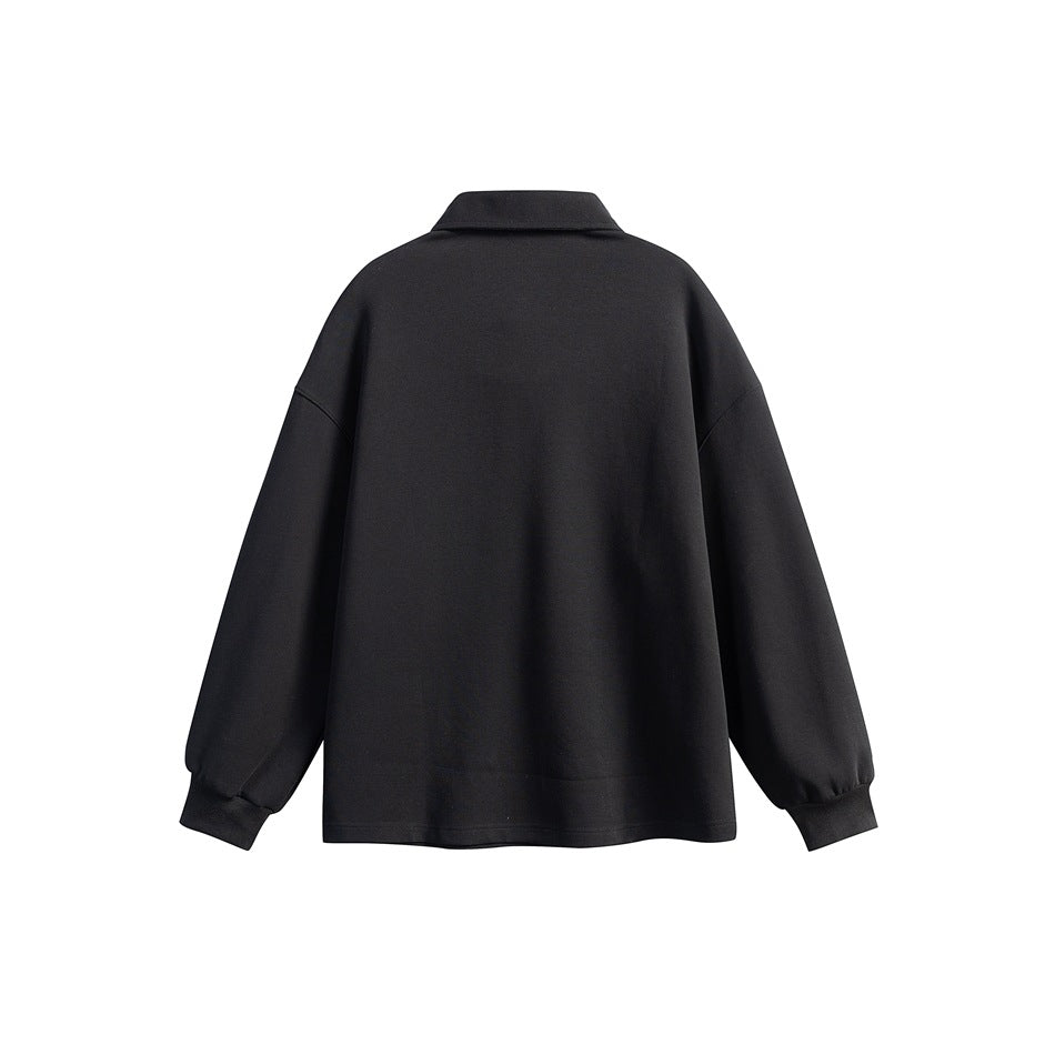 Back view of black long-sleeve polo sweatshirt with plain back, drop shoulders and ribbed cuffs
