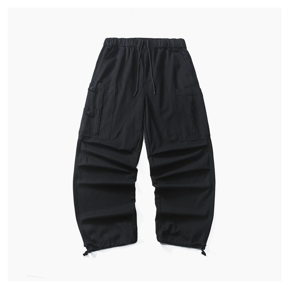 Black wide-leg cargo pants flat lay with drawstring waist, side cargo pockets and toggle hems