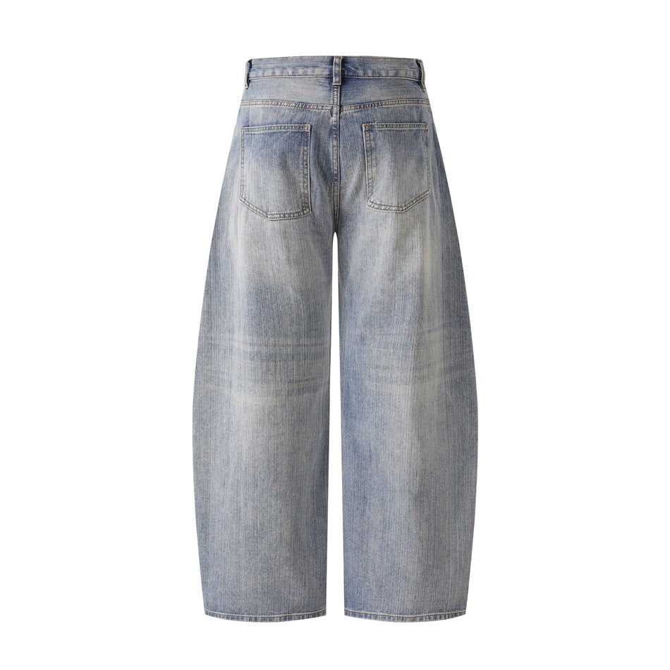 Full back view of light washed blue-gray wide-leg jeans with two back patch pockets.