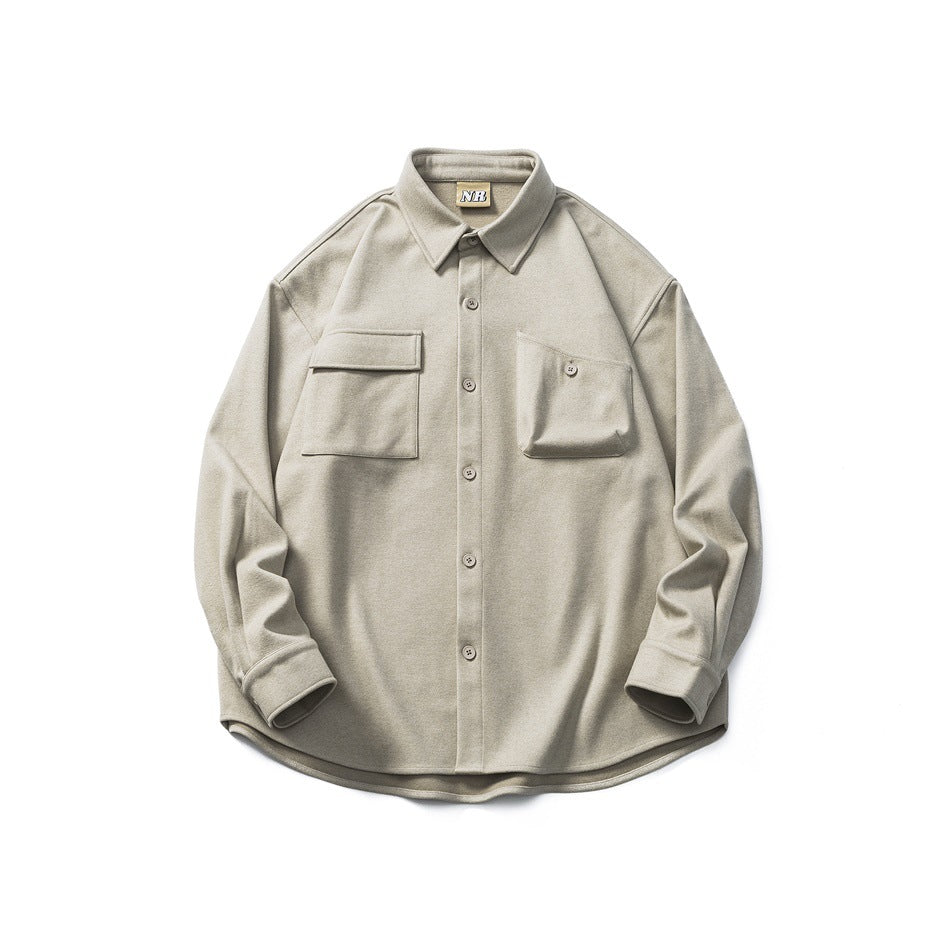 Beige long-sleeve button-front shirt with collar, two chest pockets and curved hem, flat lay front view