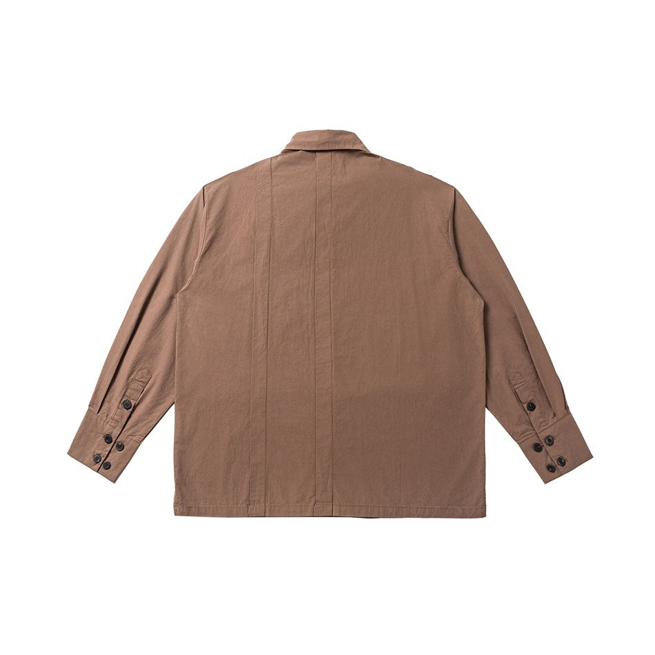 Back view of brown button-up shirt with center back pleat and multi-button cuffs, flat lay on white background