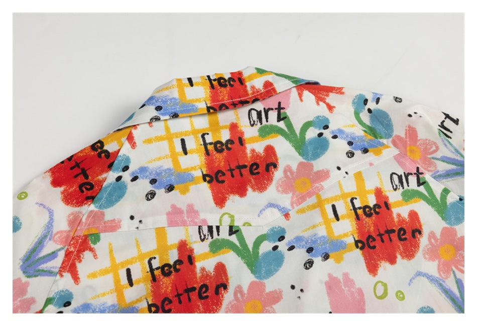 Close-up of a garment collar and upper back with colorful floral artwork and repeated black lettering.