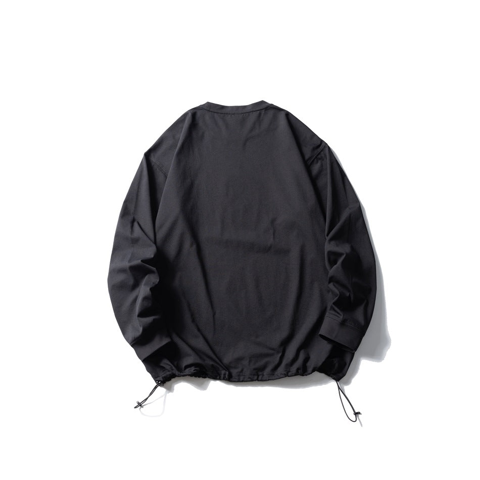 Back view of a black long-sleeve pullover with a drawcord-adjustable hem, laid flat on white.