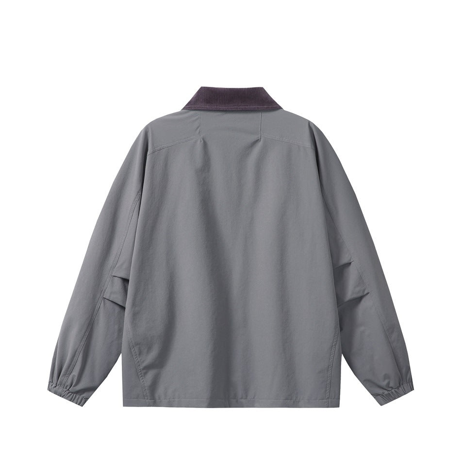 Back view of a slate gray jacket with a dark contrast collar and elasticated cuffs.