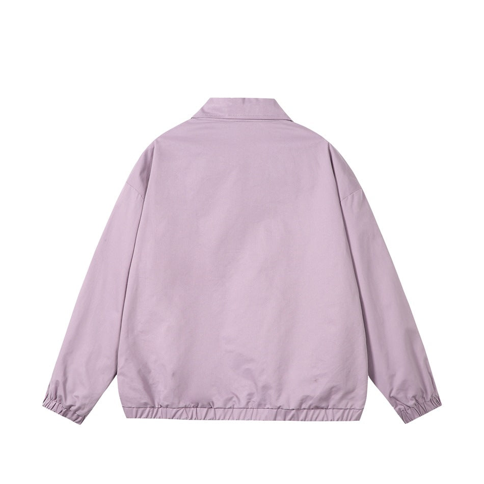 Back view of a lavender collared jacket with long sleeves and gathered cuffs and hem.