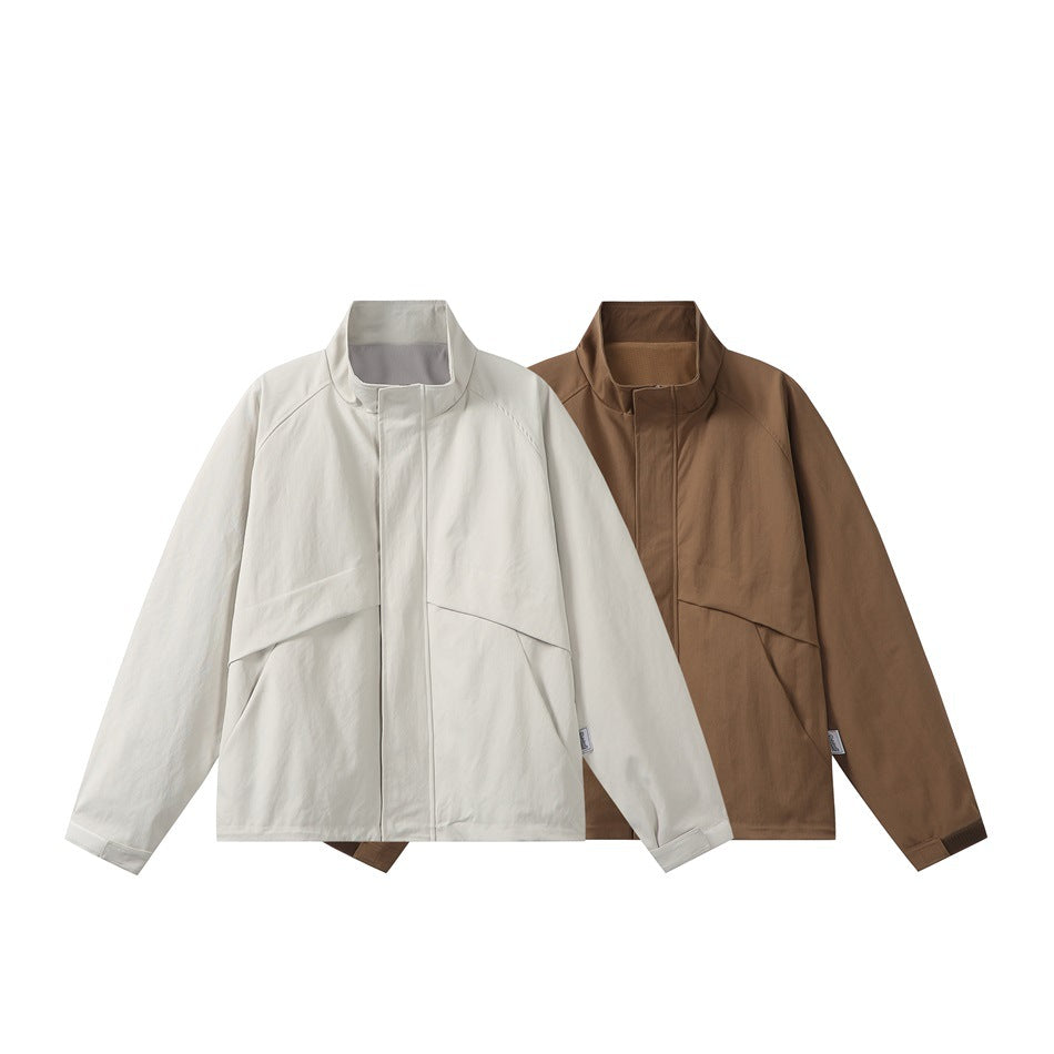 Front view of two stand-collar jackets in ivory and brown, with long sleeves and covered front closures.