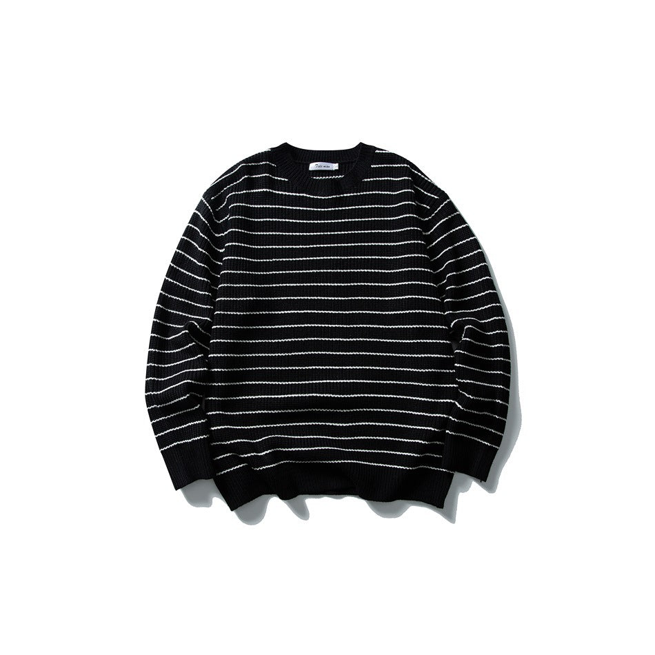 Black crewneck knit sweater with thin white horizontal stripes, flat lay